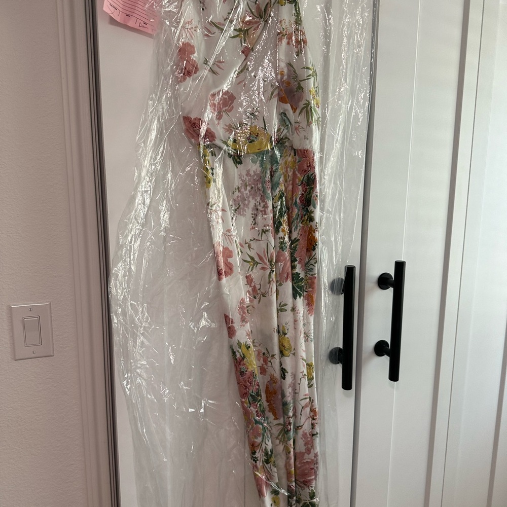 White/floral midi dress. Worn once to bridal shower. Has been dry cleaned.